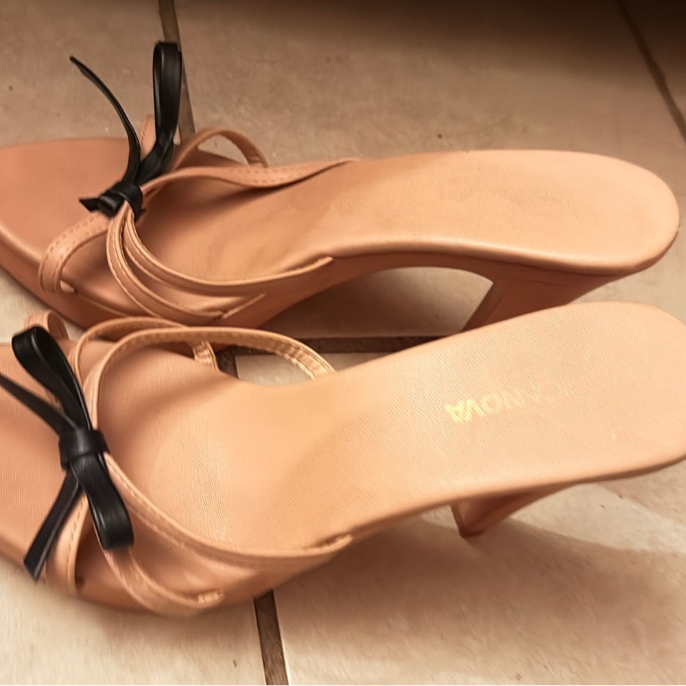 Chic Nude Heels with Black Bow